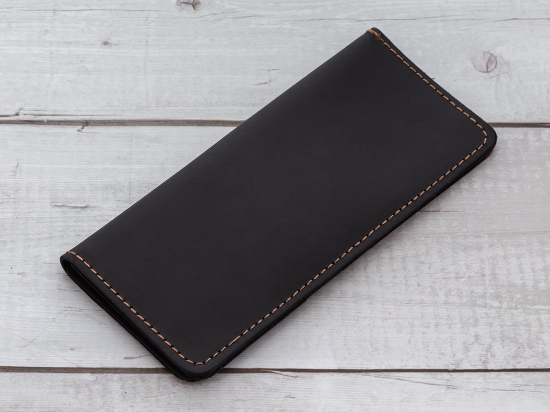 Buffalo leather bifold wallet showing natural grain texture and early patina development